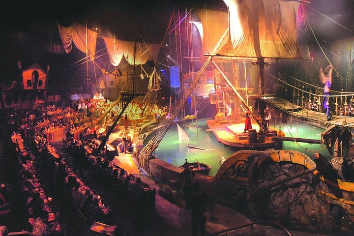 Dinner show theatre with pirate ship and diners around